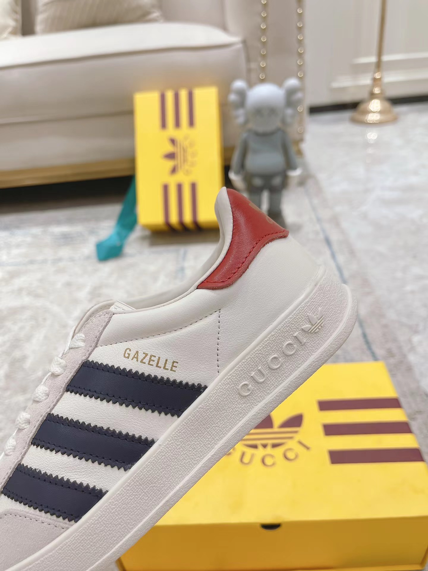 ad*s x G*u*i men’s gazelle sneaker