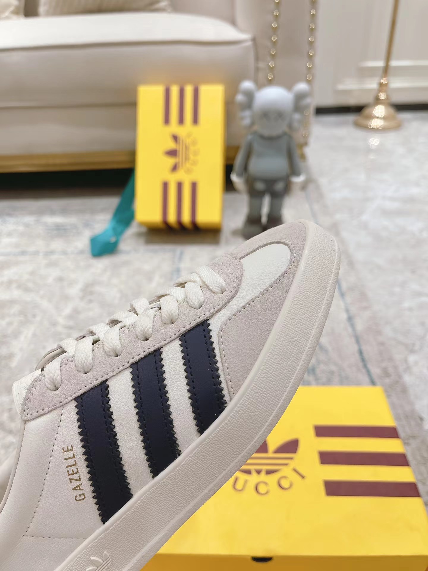 ad*s x G*u*i men’s gazelle sneaker