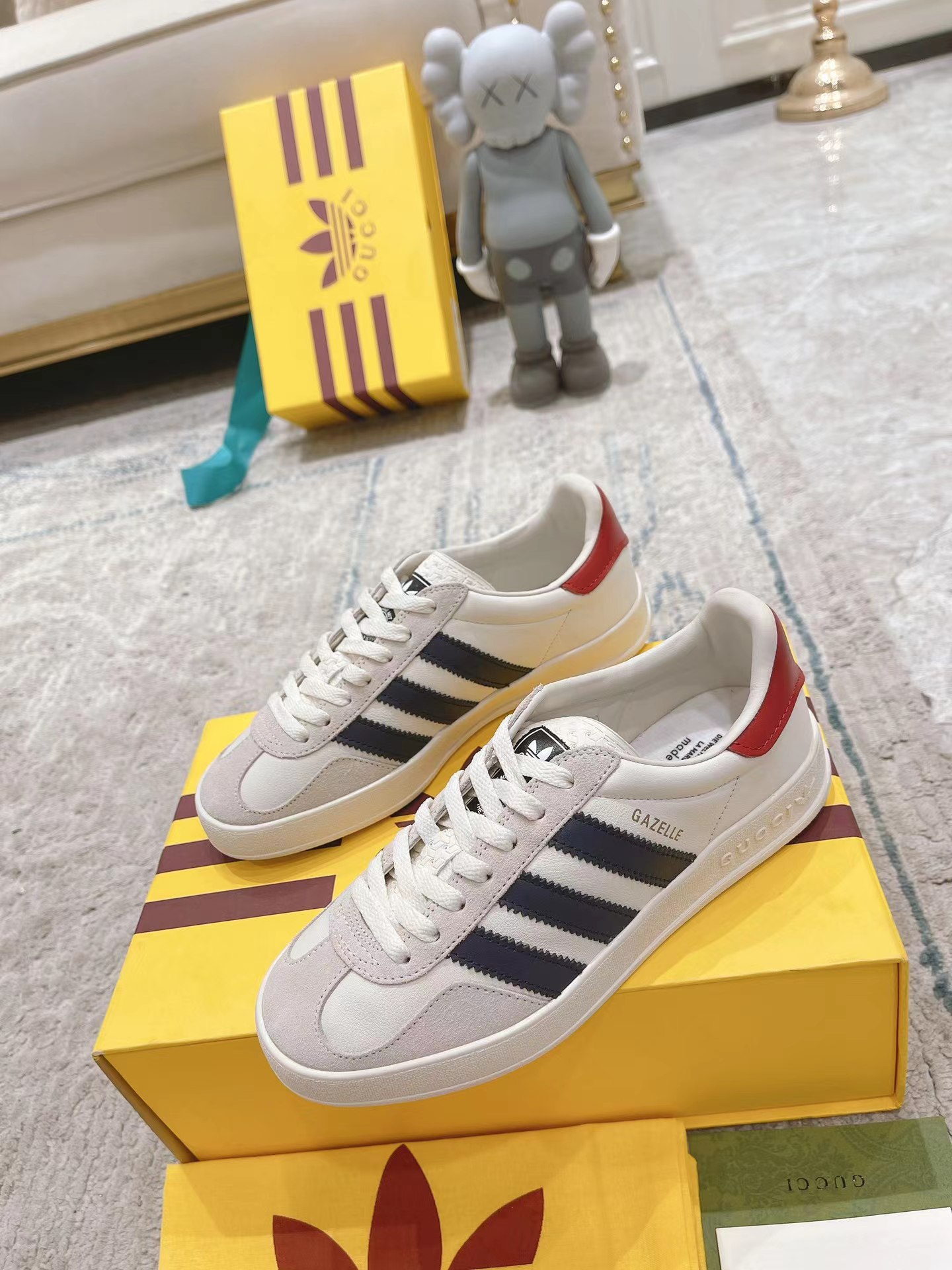 ad*s x G*u*i men’s gazelle sneaker