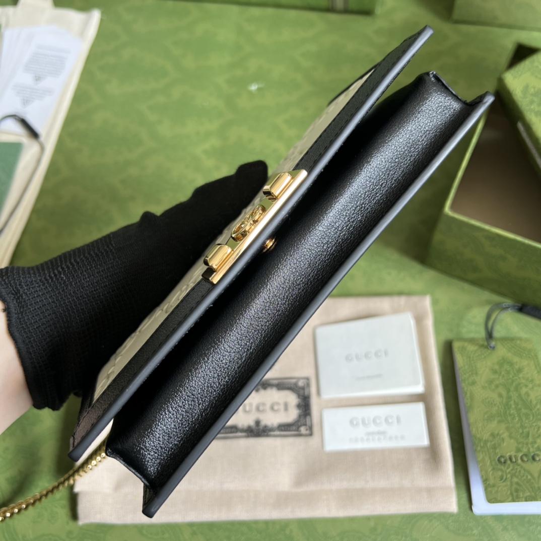 G*u*i leather clutch
