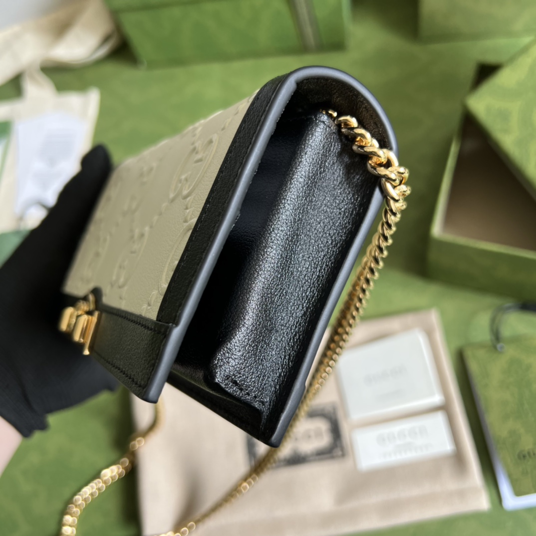 G*u*i leather clutch