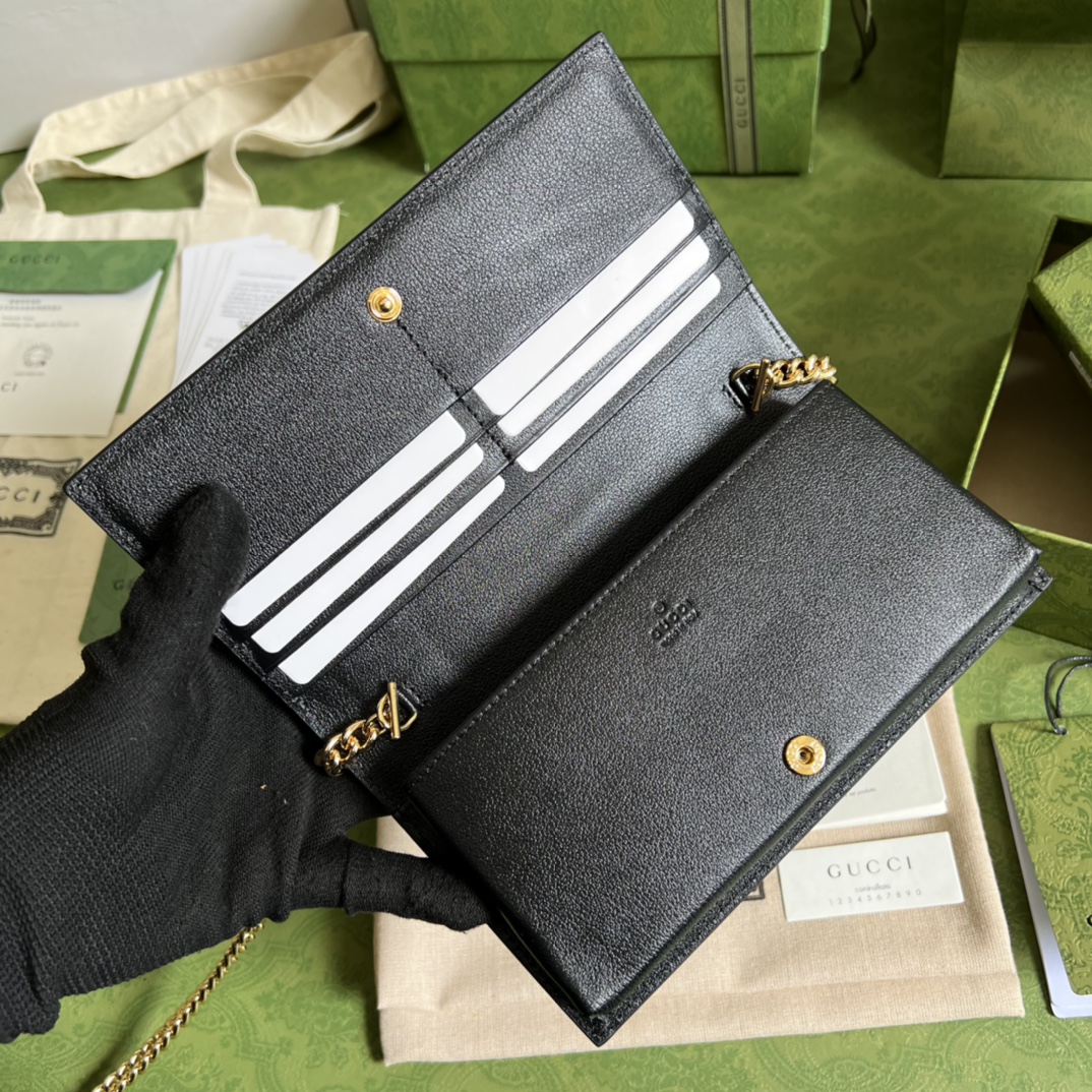 G*u*i leather clutch