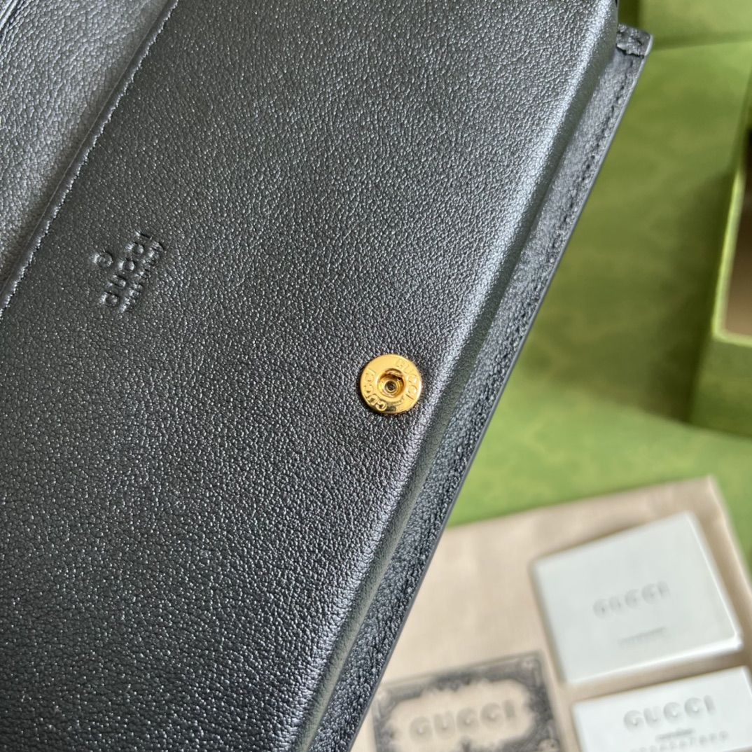 G*u*i leather clutch