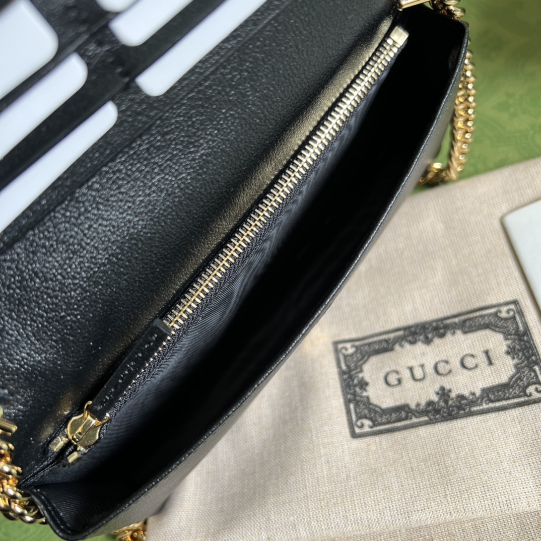 G*u*i leather clutch