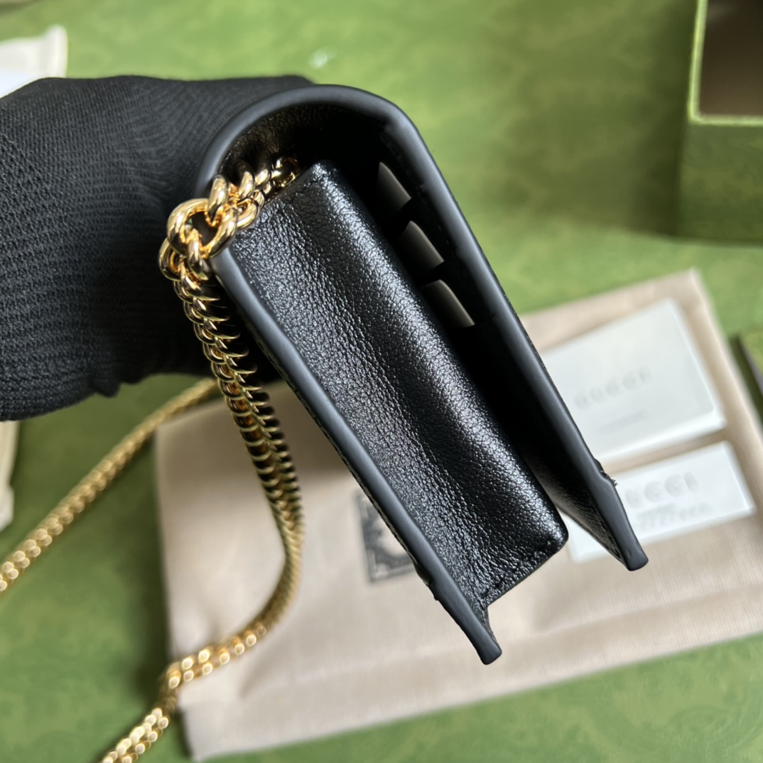 G*u*i leather clutch