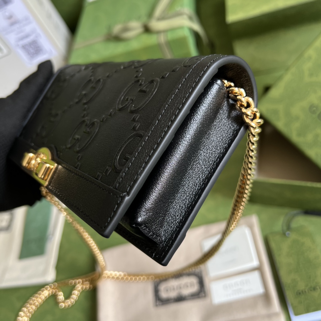 G*u*i leather clutch