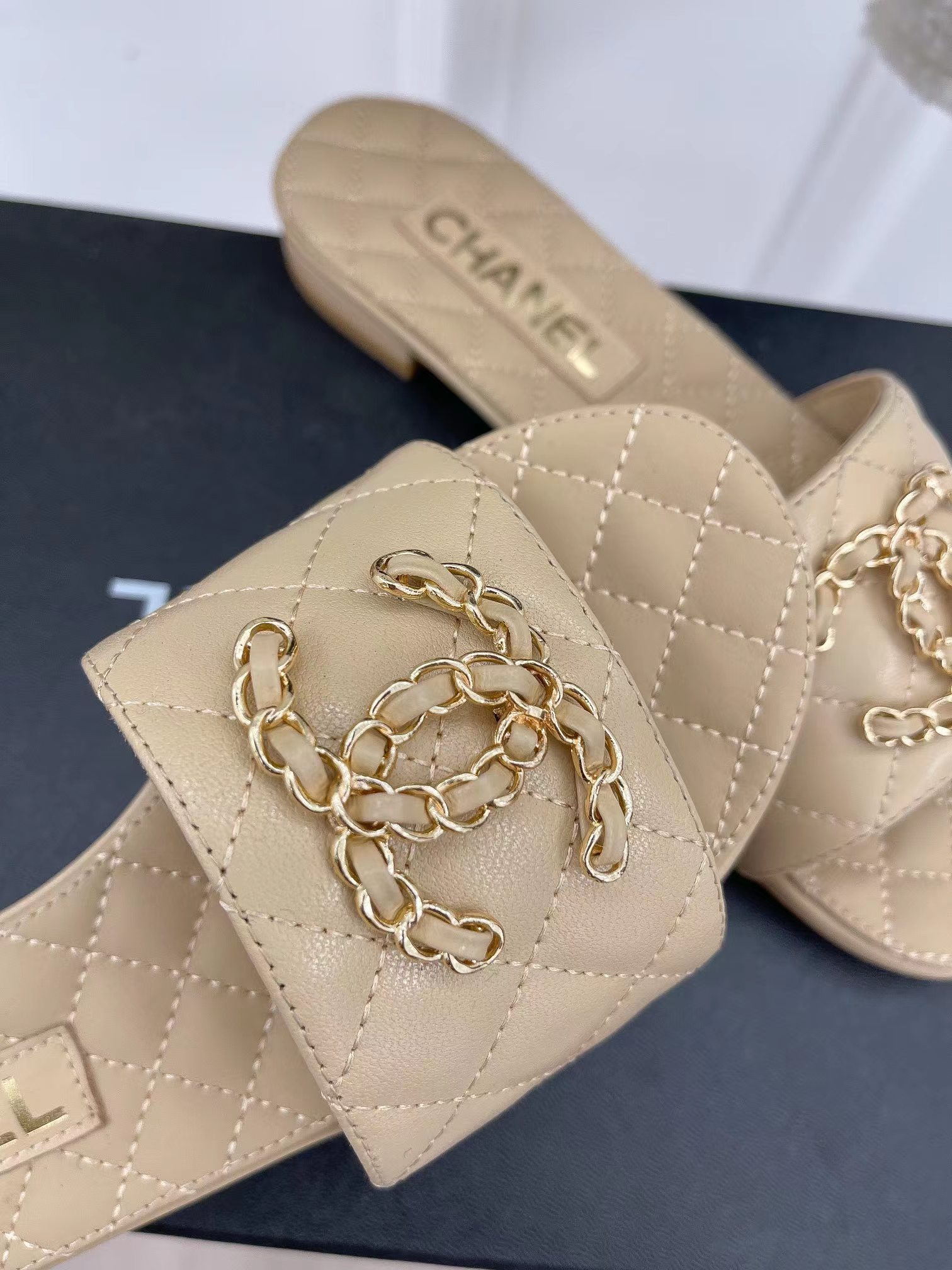 Ch*el goatskin shiny leather gold cc flat sandals